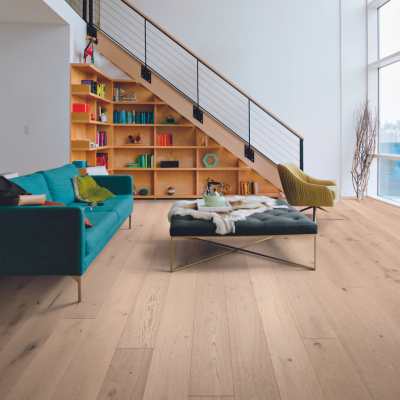 white oak hardwood floors in Scandi style living room with large windows and pops of color